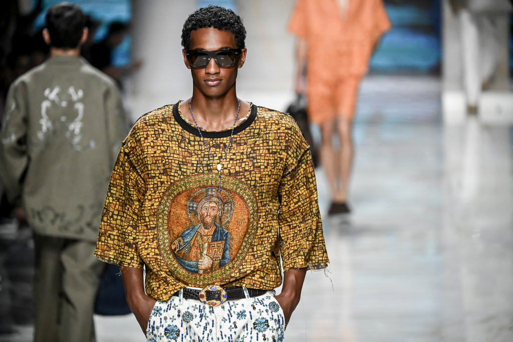A model wears a creation from the Dolce & Gabbana Spring/Summer 2027 Men's collection presented in Milan, Italy, Saturday, June 20, 2026. (AP Photo/Nicola Marfisi)