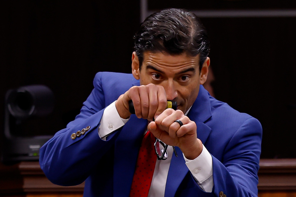 Defense attorney Nico LaHood mimics a police officer responding to a threat inside a classroom while delivering a closing statement to the jury on the 11th day of the trial for former Uvalde school district police officer Adrian Gonzales at the Nueces County Courthouse on Wednesday, Jan. 21, 2026, in Corpus Christi, Texas. (Sam Owens /The San Antonio Express-News via AP, Pool)
