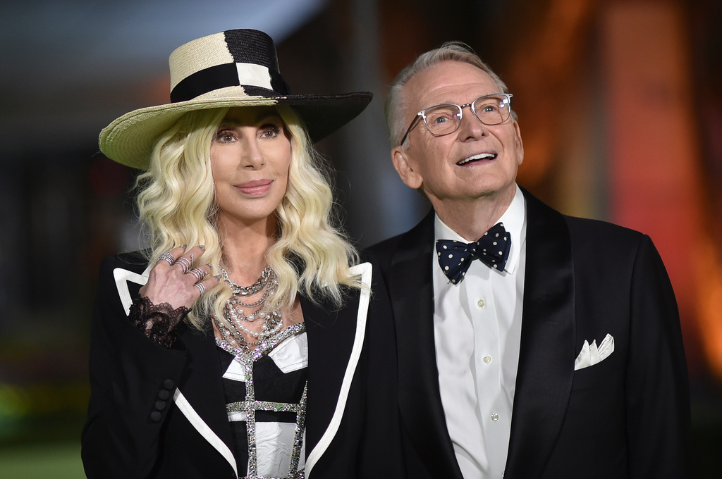 FILE - Cher, left, and designer Bob Mackie arrive at the Academy Museum of Motion Pictures Gala on Sept. 25, 2021, in Los Angeles. (Photo by Richard Shotwell/Invision/AP, File)