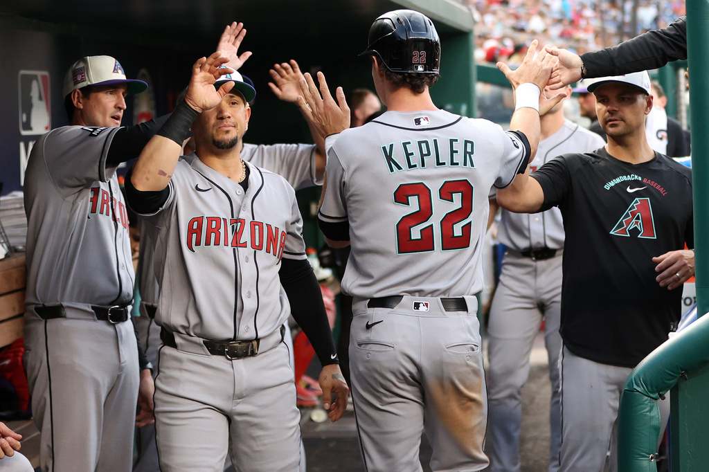 Arizona Diamondbacks' Max Kepler celebrates with his teammates after scoring a run during the second inning of a baseball game against the Washington Nationals, Friday, July 24, 2026, in Washington. (AP Photo/Daniel Kucin Jr.)