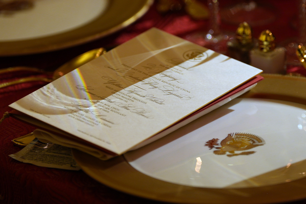 The menu is seen at a seat as President Donald Trump hosts a State Dinner for China's President Xi Jinping in the East Room of the White House, Thursday, Sept. 24, 2026, in Washington. (AP Photo/Alex Brandon)