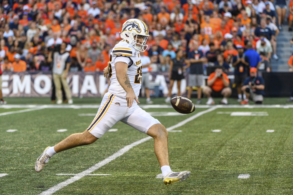 Western Michigan's Ryan Milmore punts during the first half of an NCAA college football game against Illinois Saturday, Sept. 13, 2025, in Champaign, Ill. (AP Photo/Craig Pessman)
