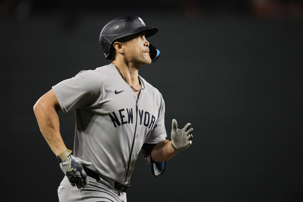 New York Yankees' Giancarlo Stanton rounds the bases after hitting a three-run home run during the first inning of a baseball game against the Baltimore Orioles, Saturday, Sept. 20, 2025, in Baltimore. (AP Photo/Stephanie Scarbrough)
