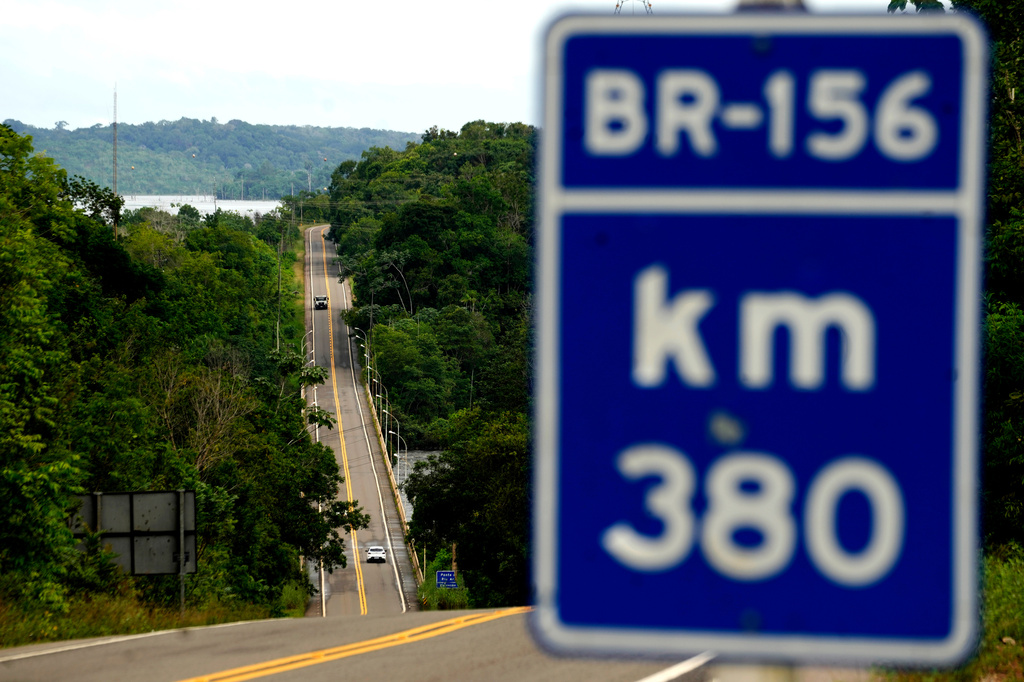 Vehicles drive on a fully paved section of BR-156 highway that connects the state capital Macapa with the city of Oiapoque, Amapa state, Brazil, Monday, March 9, 2026. (AP Photo/Eraldo Peres)