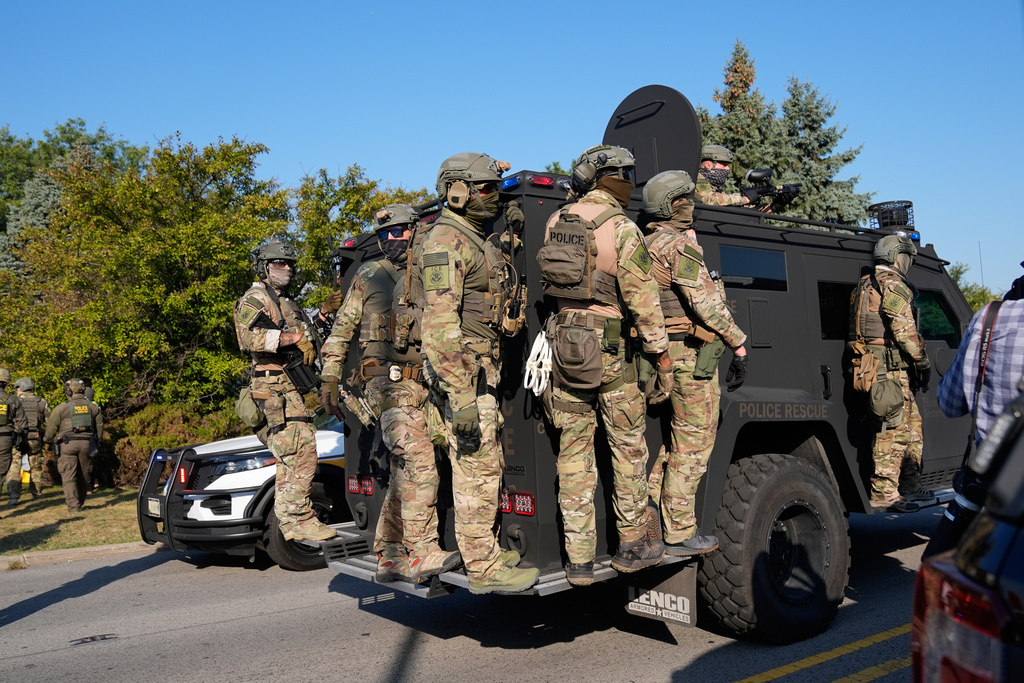 Federal law enforcement arrive near an Immigration and Customs Enforcement facility in Broadview, Ill., Friday, Oct. 3, 2025. (AP Photo/Erin Hooley)
