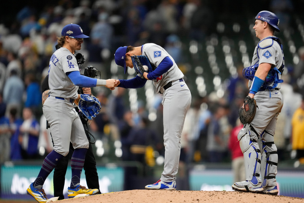 Los Angeles Dodgers pitcher Yoshinobu Yamamoto celebrates throwing a complete game against the Milwaukee Brewers, in Game 2 of baseball's National League Championship Series, Tuesday, Oct. 14, 2025, in Milwaukee. (AP Photo/Ashley Landis)