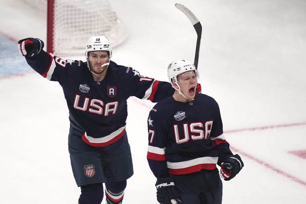 FILE - United States' Brady Tkachuk, right, celebrates after his goal against Canada with his brother Matthew Tkachuk, left, during the first period of the 4 Nations Face-Off championship hockey game, Feb. 20, 2025, in Boston. (AP Photo/Charles Krupa, File)