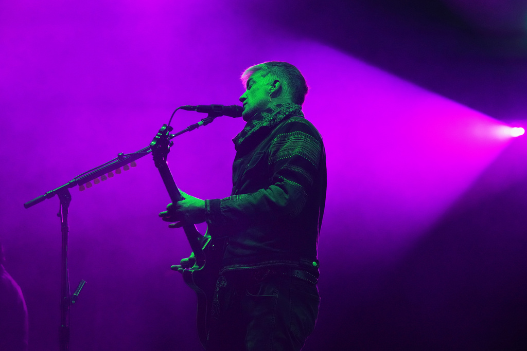 Josh Homme, of the U.S. rock band Queens of the Stone Age performs during the Corona Capital music festival in Mexico City, Friday, Nov. 14, 2025. (AP Photo/Eduardo Verdugo)