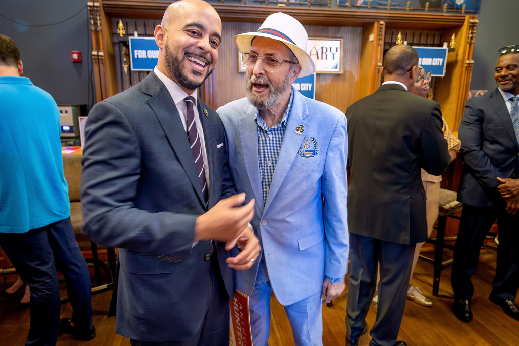 State Sen. Royce Duplessis, left, talks with Louis Charbonnet after an event where Arthur Hunter announced he is ending his campaign in the New Orleans mayor's race and endorsing Duplessis, Thursday, Aug. 7, 2025. (Brett Duke/The Times-Picayune/The New Orleans Advocate via AP)