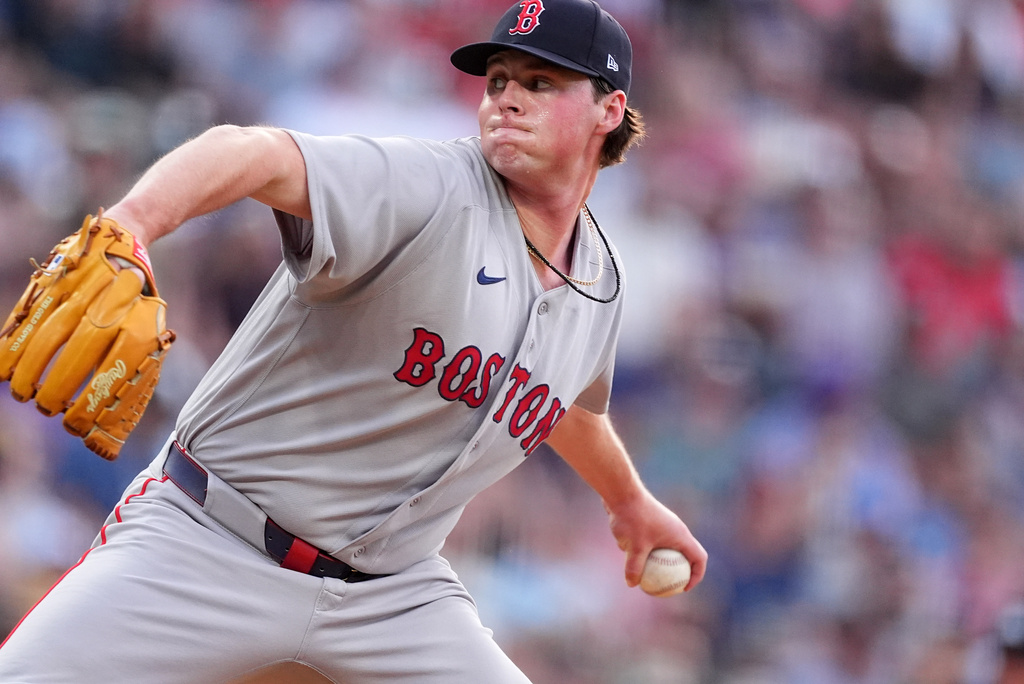 Boston Red Sox starting pitcher Jake Bennett works against the Colorado Rockies in the first inning of a baseball game Monday, June 22, 2026, in Denver. (AP Photo/David Zalubowski)
