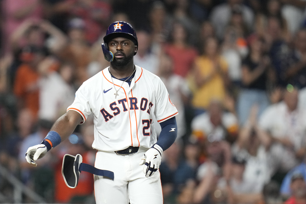 Houston Astros' Taylor Trammell (26) reacts as he was walked by New York Yankees relief pitcher Devin Williams with the bases loaded, scoring a run during the eighth inning of a baseball game Wednesday, Sept. 3, 2025, in Houston. (AP Photo/Karen Warren)
