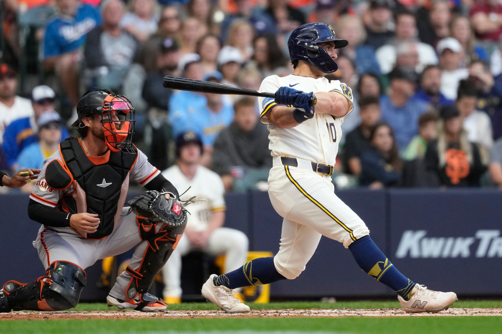 Milwaukee Brewers' Sal Frelick hits an RBI double during the second inning of a baseball game against the San Francisco Giants, Monday, June 1, 2026, in Milwaukee. (AP Photo/Aaron Gash)