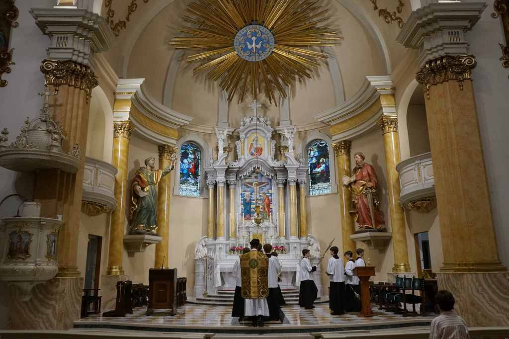 The Rev. John Ubel, pastor of the Church of Saint Agnes, processes into the sanctuary with altar servers at the start of one of the Catholic parish’s Latin Masses in St. Paul, Minn., Sunday, June 28, 2026. (AP Photo/Giovanna Dell’Orto)