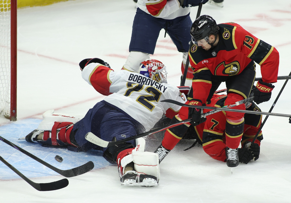 Ottawa Senators' Drake Batherson (19) tries to get the puck past Florida Panthers goaltender Sergei Bobrovsky (72) during the first period of an NHL hockey game in Ottawa on Saturday, Jan. 10, 2026. (Patrick Doyle/The Canadian Press via AP)
