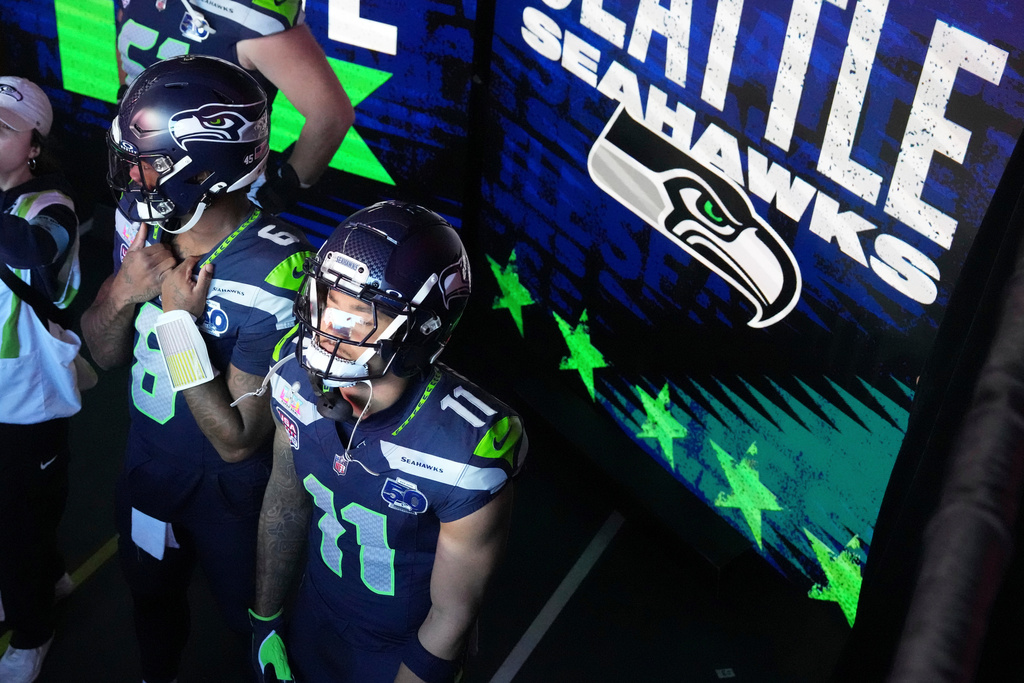 Seattle Seahawks quarterback Jalen Milroe (6) and wide receiver Jaxon Smith-Njigba (11) wait to take the field for the NFL Super Bowl 60 football game against the New England Patriots, Sunday, Feb. 8, 2026, in Santa Clara, Calif. (AP Photo/Godofredo A. Vásquez)