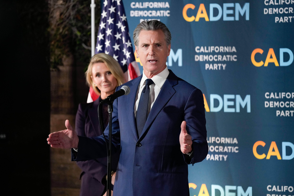 California Gov. Gavin Newsom stands with first partner Jennifer Siebel Newsom as he speaks during an election night press conference at a California Democratic Party office Tuesday, Nov. 4, 2025, in Sacramento, Calif. (AP Photo/Godofredo A. Vásquez)