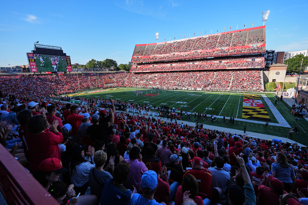 Fans cheer during the first half of an NCAA college football game between Maryland and Washington, Saturday, Oct. 4, 2025, in College Park, Md. (AP Photo/Stephanie Scarbrough)