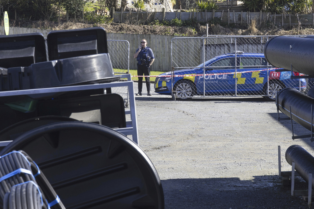 A police officer stands near a hardware store in Piopo in the Waikato district of New Zealand, Monday, Sept. 8, 2025. (Ricky Wilson/Stuff via AP)