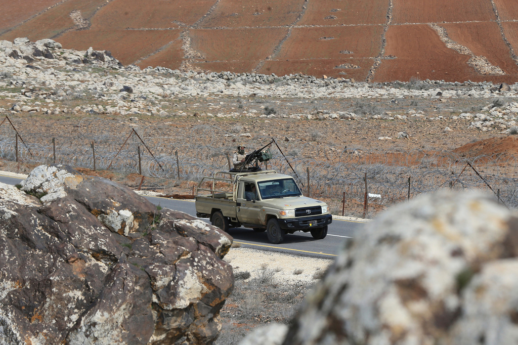 FILE - Jordanian soldiers patrol along the eastern Jordan-Syria border, in al-Washash, Mafraq governorate, Jordan, Thursday, Feb. 17, 2022, during media tour organised by the Jordanian army. (AP Photo/Raad Adayleh, File)