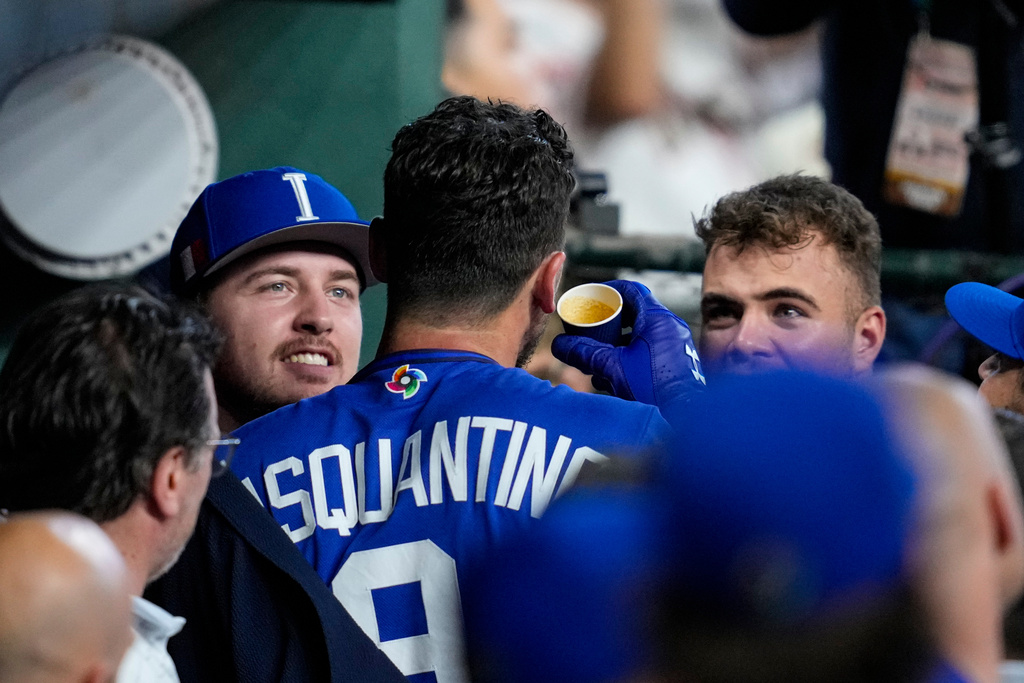 Italy first baseman Vinnie Pasquantino celebrates a home run with an expresso in the second inning of a World Baseball Classic game against Mexico, Wednesday, March 11, 2026, in Houston. (AP Photo/Ashley Landis)