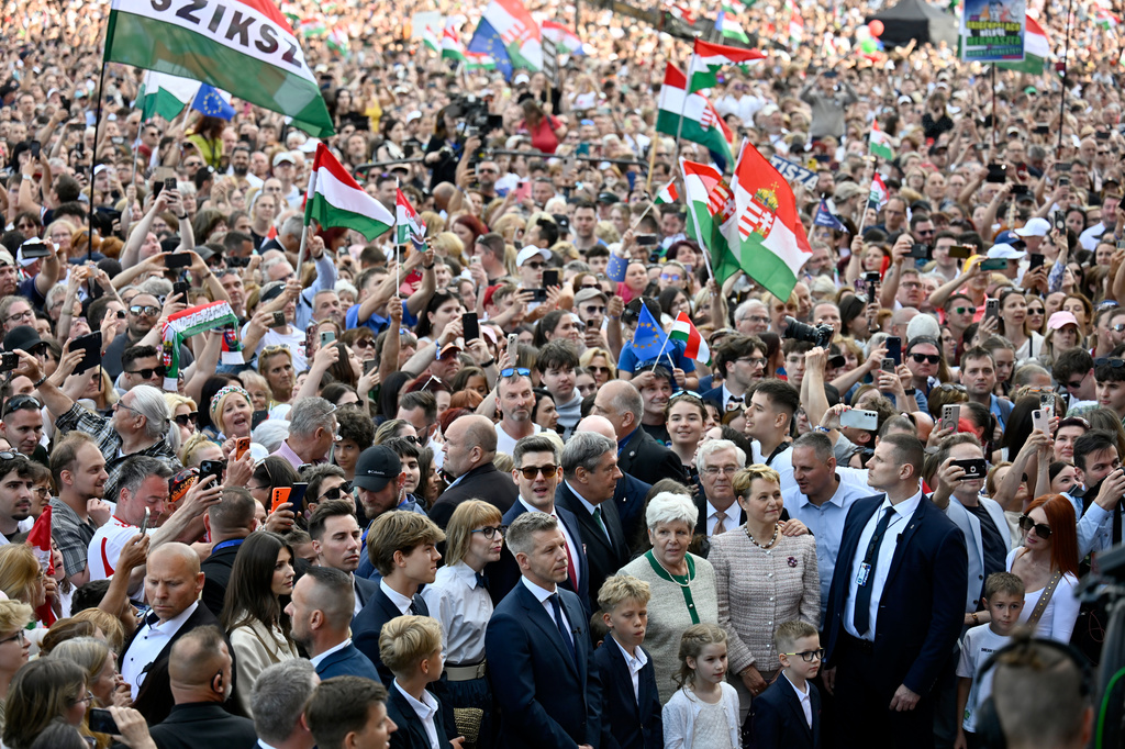 People gathered in front of the Hungarian Parliament after Hungarian Prime Minister Peter Magyar took his oath of office in Budapest, Hungary, Saturday, May 9, 2026. (AP Photo/Denes Erdos)