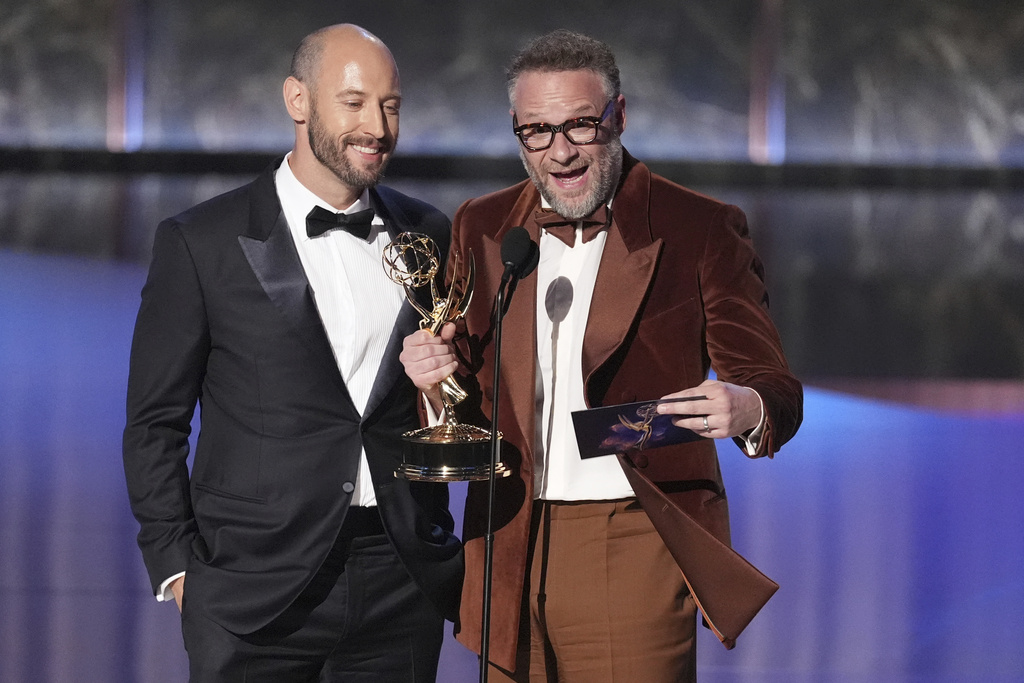 Evan Goldberg, left, and Seth Rogen accept the award for outstanding directing for a comedy series for "The Studio" during the 77th Primetime Emmy Awards on Sunday, Sept. 14, 2025, at the Peacock Theater in Los Angeles. (AP Photo/Chris Pizzello)