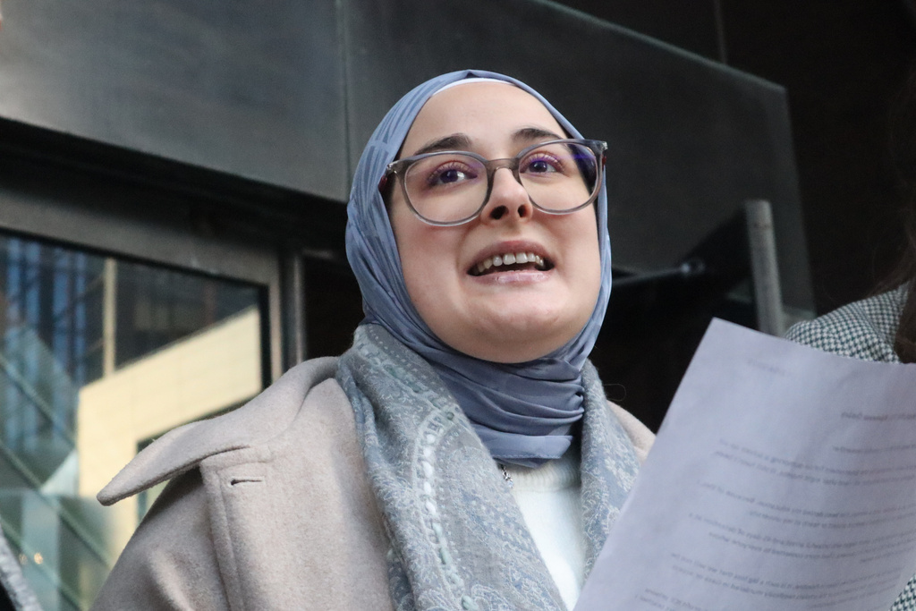 Tufts University doctoral student Rumeysa Ozturk reads from a prepared statement following a court hearing outside the John Joseph Moakley United States Courthouse Thursday, Dec. 4, 2025, in Boston. (AP Photo/Leah Willingham)
