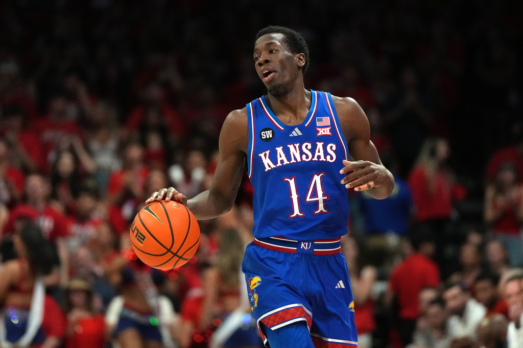 FILE - Kansas guard Melvin Council Jr. (14) during the first half of an NCAA college basketball game against Arizona, on Feb. 28, 2026, in Tucson, Ariz. (AP Photo/Rick Scuteri, File)