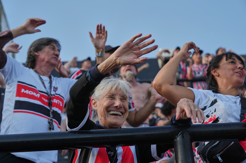Chacarita Juniors fans cheer during an Argentine league against Gimnasia y Tiro in Buenos Aires, Argentina, Sunday, April 12, 2026. (AP Photo/Rodrigo Abd)