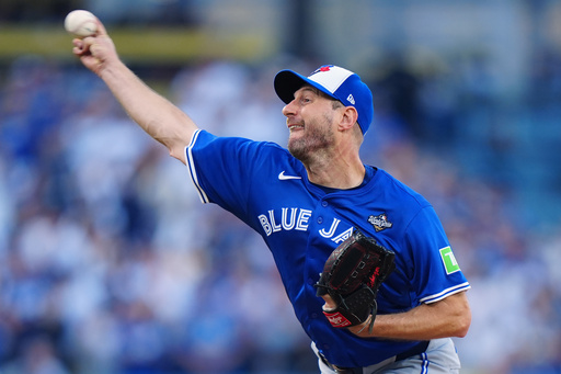 Toronto Blue Jays pitcher Max Scherzer delivers against the Los Angeles Dodgers during the first inning in Game 3 of baseball's World Series in Los Angeles, Monday, Oct. 27, 2025. (Frank Gunn/The Canadian Press via AP) Toronto Blue Jays pitcher Max Scherzer delivers against the Los Angeles Dodgers during the first inning in Game 3 of baseball's World Series in Los Angeles, Monday, Oct. 27, 2025. (Frank Gunn/The Canadian Press via AP)