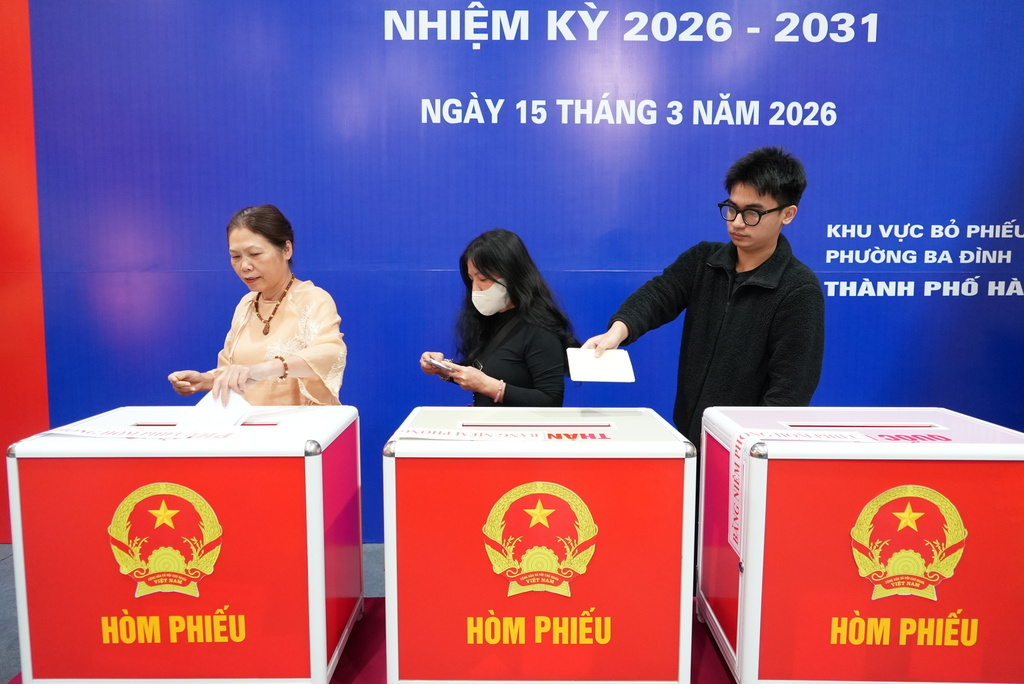 Voters cast ballots to elect representatives in the National Assembly and people's councils in Hanoi, Vietnam, Sunday, March 15, 2026. (AP Photo/Hau Dinh)