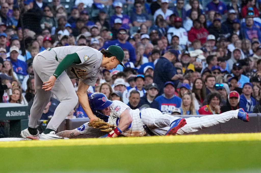 Athletics third baseman Zack Gelof, left, tags out Chicago Cubs' Pete Crow-Armstrong during the first inning of a baseball game in Chicago, Tuesday, June 2, 2026. (AP Photo/Nam Y. Huh)