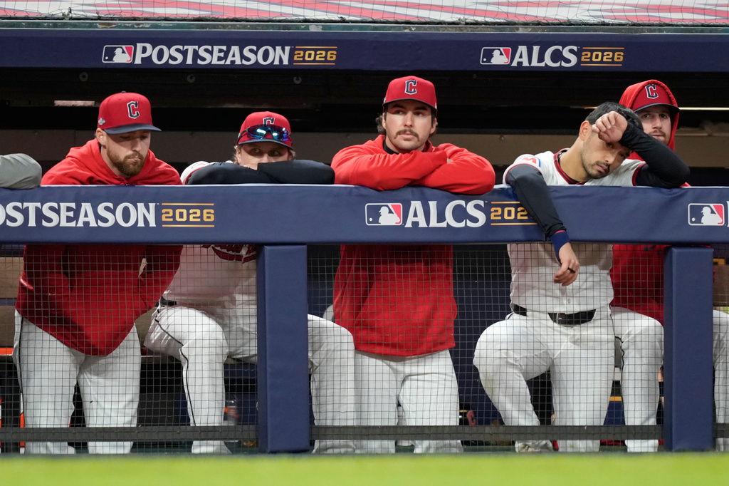 Members of the Cleveland Guardians watch during their lose against the Tampa Bay Rays in Game 5 of an American League Championship Series baseball game in Cleveland, Sunday, Oct. 18, 2026. (AP Photo/David J. Phillip)