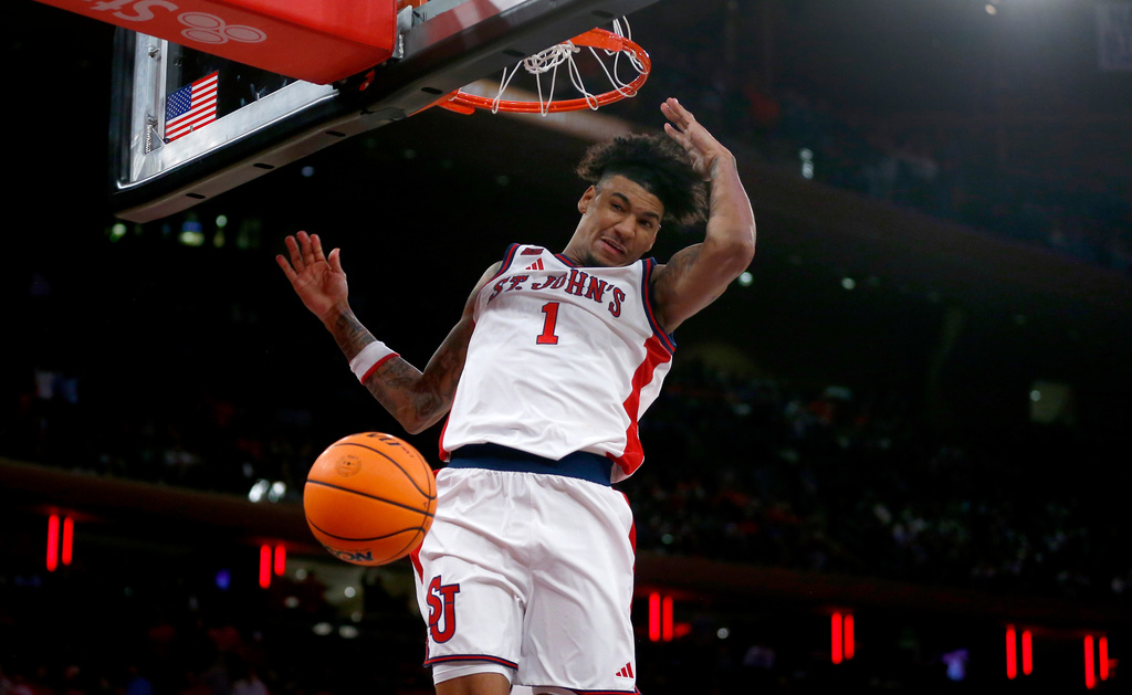St. John's forward Dillon Mitchell dunks during the second half of an NCAA college basketball game against UConn Friday, Feb. 6, 2026, in New York. (AP Photo/John Munson)