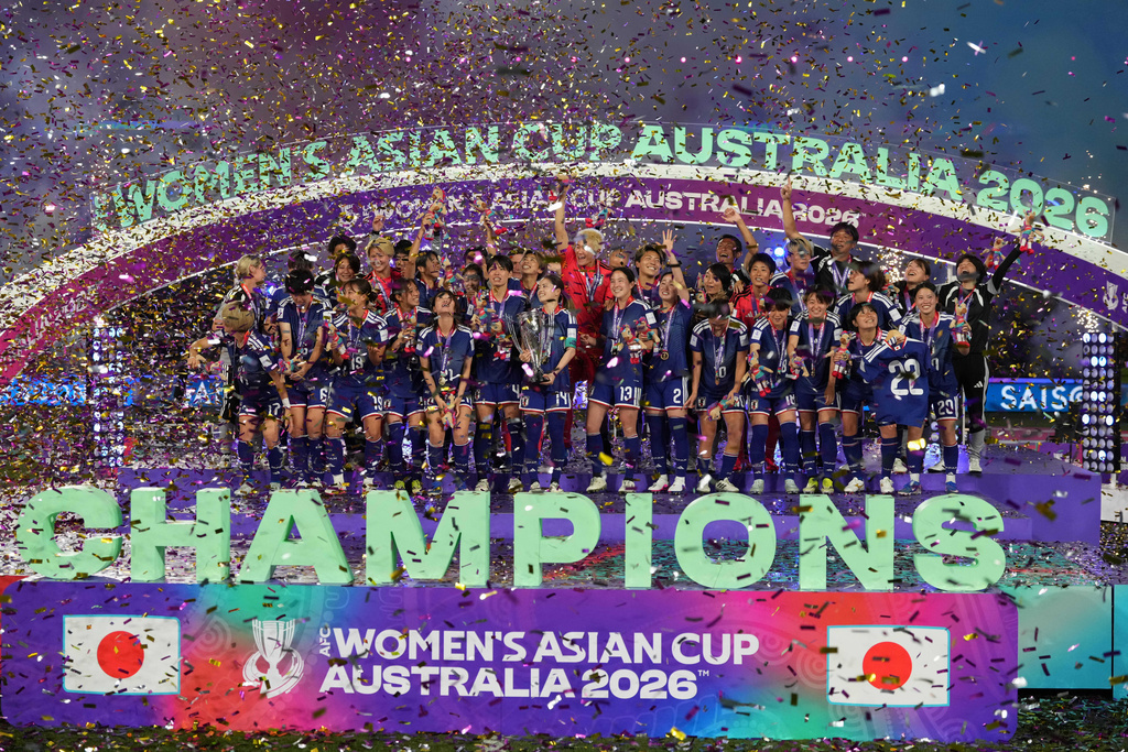 Japanese players pose after winning against Australia at Women's Asian Cup soccer final in Sydney, Saturday, March 21, 2026. (AP Photo/Mark Baker)