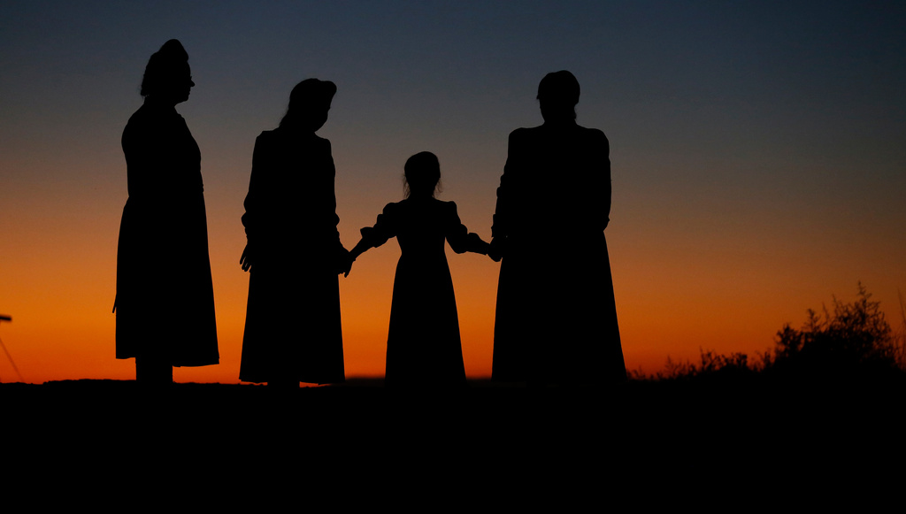 FILE - From left, Esther Bistline, Angie Bistline, Lydia Ann Richter and Norma Richter gather to pose for photographs in Colorado City, Ariz., on Wednesday, Oct. 25, 2017. (AP Photo/Rick Bowmer, File)