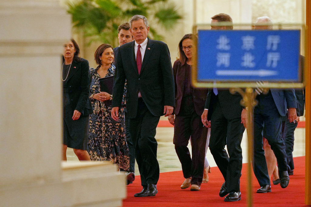 U.S. Senator Steve Daines walks with his congressional delegation as they arrive to the Great Hall of the People to meet with Chinese Foreign Minister Wang Yi, in Beijing, Thursday, May 7, 2026. (AP Photo/Andy Wong, Pool)