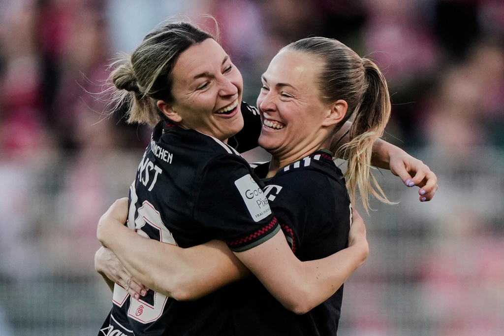 Bayern's Magdalena Eriksson, right, and Bayern's Barbara Dunst celebrate their side's second goal during a German women's Bundesliga soccer match between 1.FC Union Berlin and Bayern Munich in Berlin, Germany, Wednesday, April 22, 2026. (AP Photo/Ebrahim Noroozi)