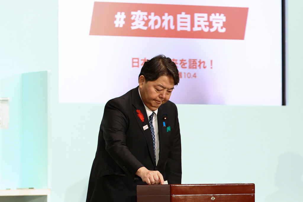 Japan's Chief Cabinet Secretary Yoshimasa Hayashi votes at the Liberal Democratic Party's (LDP) leadership election in Tokyo, Japan, Saturday, Oct. 4, 2025. (Kim Kyung-Hoon/Pool Photo via AP)