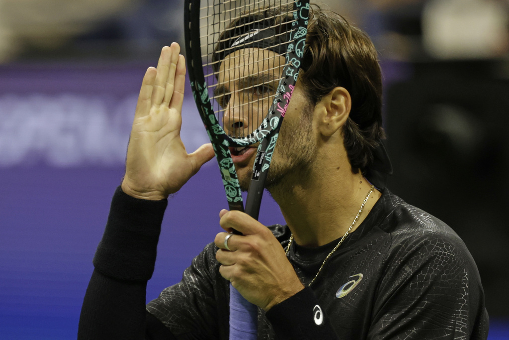 Lorenzo Musetti, of Italy, reacts during a match against Jannik Sinner, of Italy, at the quarterfinal round of the U.S. Open tennis championships, Wednesday, Sept. 3, 2025, in New York. (AP Photo/Adam Hunger)