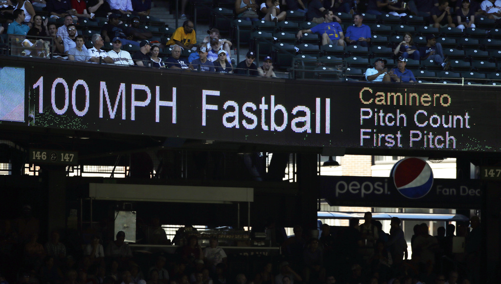 FILE - The 100 mph speed of Seattle Mariners' Arquimedes Caminero's fastball is shown on a scoreboard during a baseball game against the New York Yankees, Aug. 24, 2016, in Seattle. (AP Photo/Elaine Thompson, File)