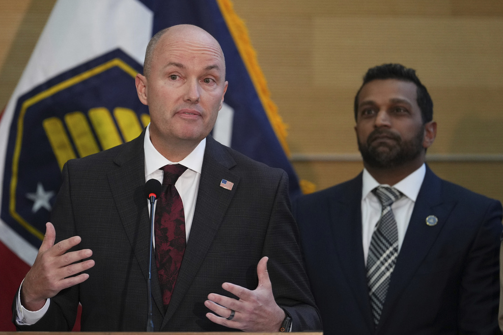 Utah Gov. Spencer Cox speaks at a news conference, as FBI Director Kash Patel looks on, Friday, Sept. 12, 2025, in Orem, Utah, (AP Photo/Lindsay Wasson)