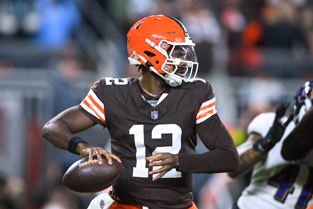 Cleveland Browns quarterback Shedeur Sanders (12) drops back to pass in the second half of an NFL football game against the Baltimore Ravens in Cleveland, Sunday, Nov. 16, 2025. (AP Photo/David Richard)