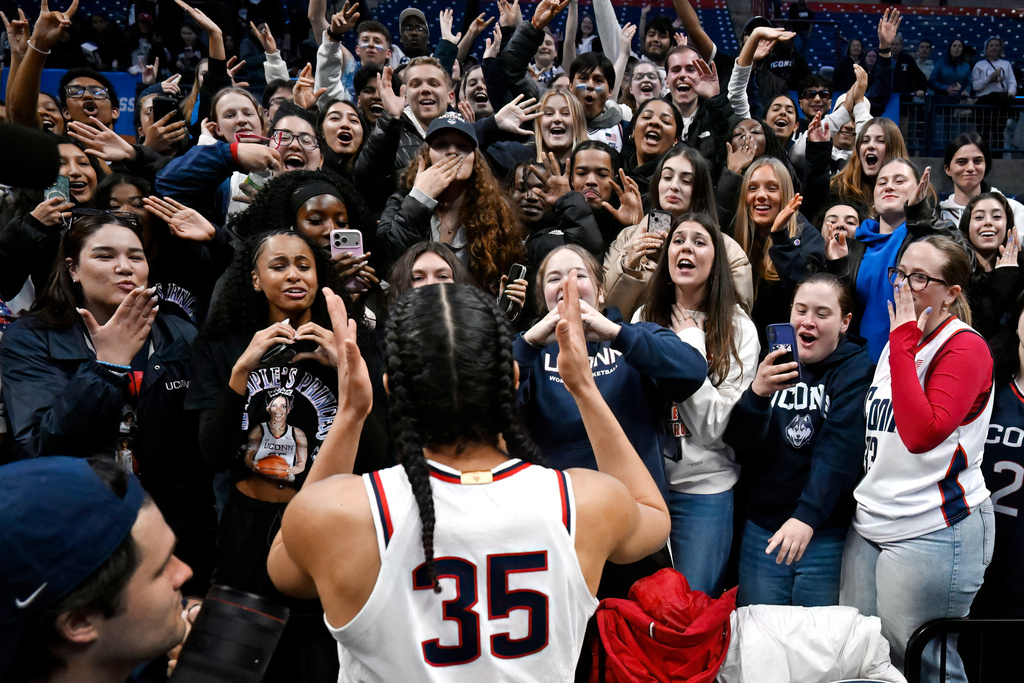 UConn guard Azzi Fudd (35) greets students at the end the second round of the NCAA college basketball tournament against Syracuse, Monday, March 23, 2026, in Storrs, Conn. (AP Photo/Jessica Hill)