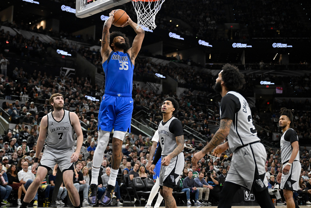 Dallas Mavericks forward Marvin Bagley III (35) dunks during the first half of an NBA basketball game against the San Antonio Spurs, Saturday, Feb. 7, 2026, in San Antonio. (AP Photo/Darren Abate)