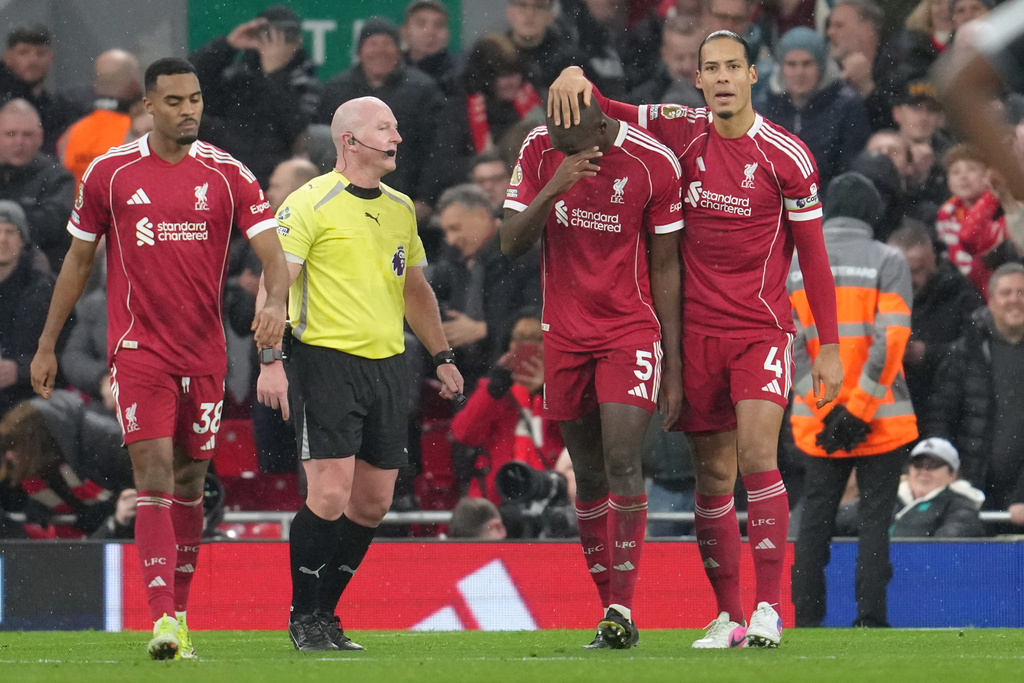 Liverpool's Ryan Gravenberch, left, Liverpool's Ibrahima Konate and Liverpool's Virgil van Dijk, right, celebrate after scoring their side's fourth goal during the English Premier League soccer match between Liverpool and Newcastle in Liverpool, England, Saturday, Jan. 31, 2026.(AP Photo/Jon Super)