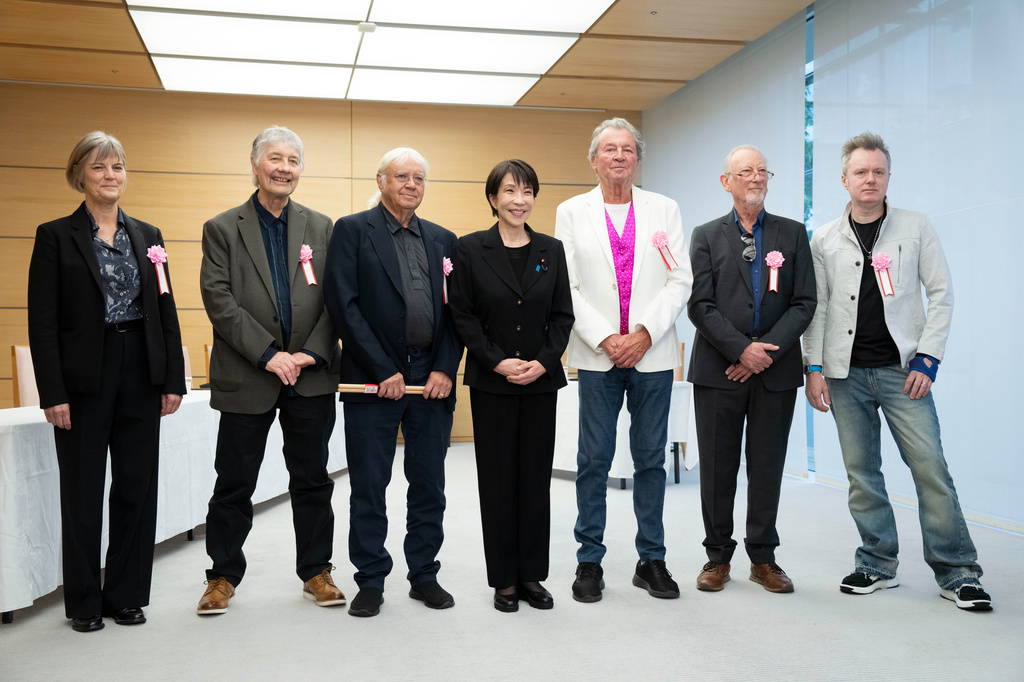 Japan's Prime Minister Sanae Takaichi, poses with members of British rock band Deep Purple, Don Airey, second left, Ian Paice, third left, Ian Gillan, third right, Roger Glover, second right Simon McBrideat, right, and British Ambassador to Japan Julia Longbottom, left, during their meeting the Prime Minister's Office in Tokyo, Friday, April 10, 2026. (Yuichi Yamazaki/Pool Photo via AP)