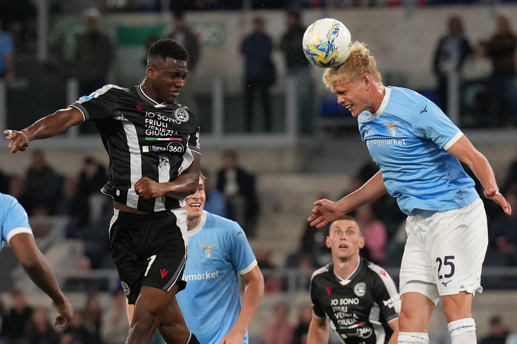 Udinese's Idrissa Gueye, left, and Lazio's Oliver Provstgaard in action during the Serie A soccer match between Lazio and Udinese in Rome, Italy, Monday April 27, 2026. (Alfredo Falcone/LaPresse via AP)