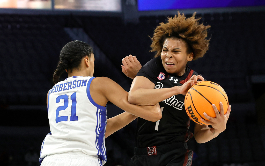 South Carolina guard Maddy McDaniel grabs a rebound against Duke center Arianna Roberson (21) during the first half of an NCAA college basketball game in the Players Era tournament, Wednesday, Nov. 26, 2025, in Las Vegas. (AP Photo/Steve Marcus)