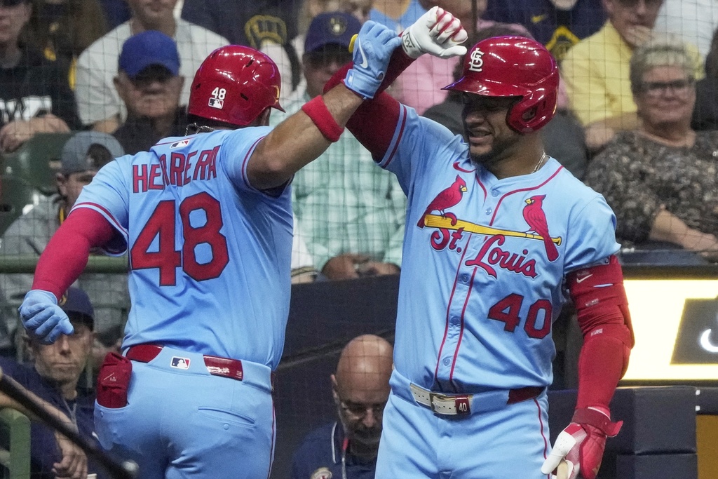 St. Louis Cardinals' Iván Herrera is congratulated by Willson Contreras after hitting a home run during the first inning of a baseball game against the Milwaukee Brewers Saturday, Sept. 13, 2025, in Milwaukee. (AP Photo/Morry Gash)